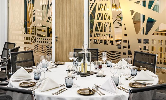 Meeting room with tables set for dinner
